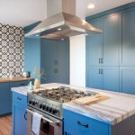 Large kitchen with muted blue furniture