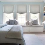 Bedroom interior in soft blue, filled with freshness and air