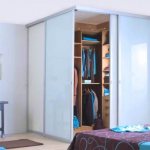 bedroom with corner wardrobe design